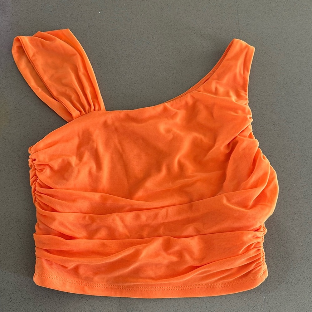 Cute size small orange shirt new never worn with tags on